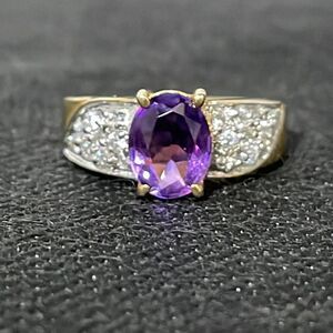Large ring with a large purple gem